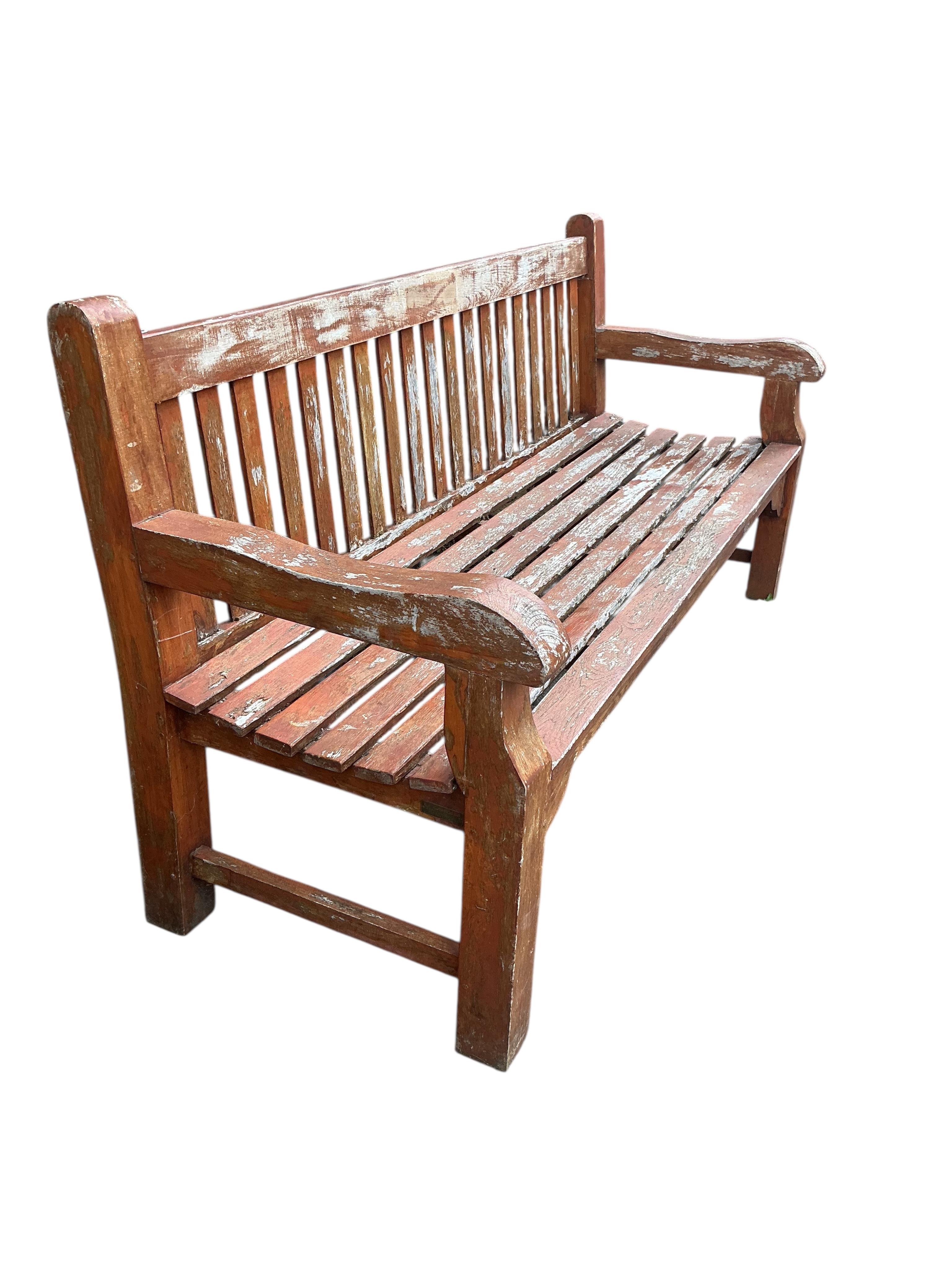 A Lindsey weathered stained teak garden bench, width 180cm, depth 66cm, height 94cm
